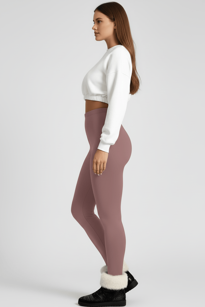 Side full-length view, woman wearing rose pink CozyTherm™ leggings C#color_rose-pink