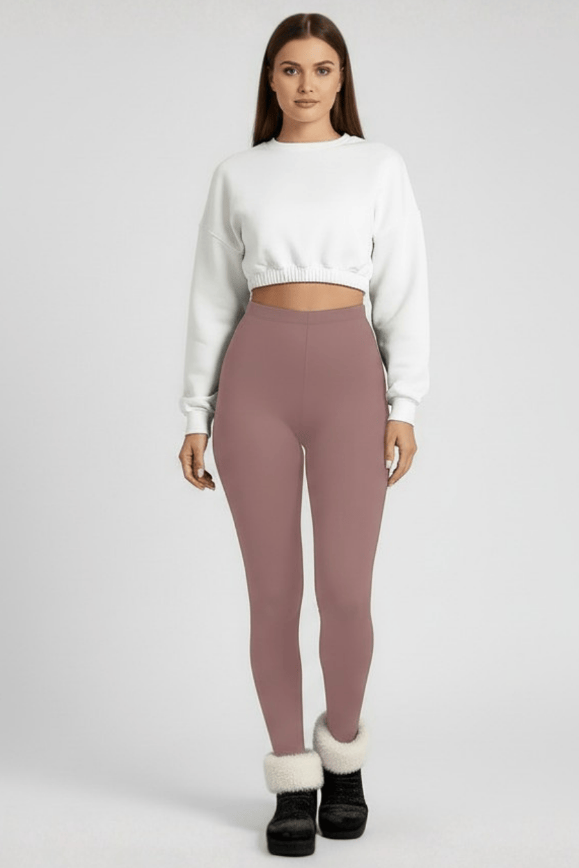 Front full-length view, woman wearing rose pink CozyTherm™ leggings in neutral pose A#color_rose-pink