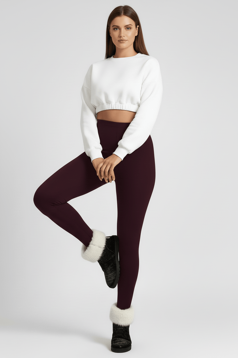 Stretch pose showing movement and fabric stretch, maroon CozyTherm™ leggings G#color_maroon