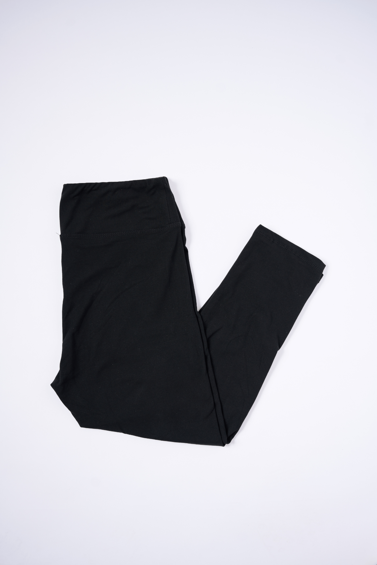 oolala Capri Solid Black Capri with Yoga Band Solid Black Capri with Yoga Band - Soft, comfortable leggings. Beautiful designs and patterns. 